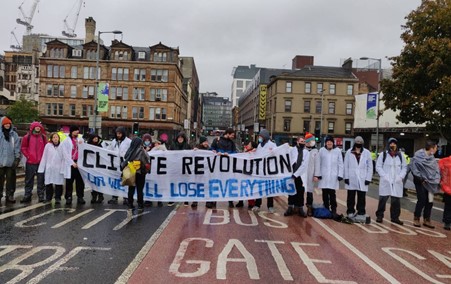 XR Scientists with a banner reading "Climate revolution or we will lose everything"