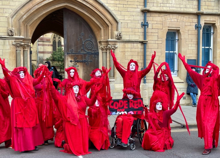 The Oxford Red Rebels with a sign reading Code Red for Climate